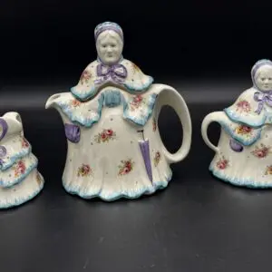 Antique teapot and pitchers with figures
