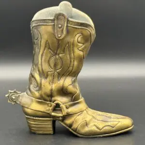 Ornate cowboy boot on dark background